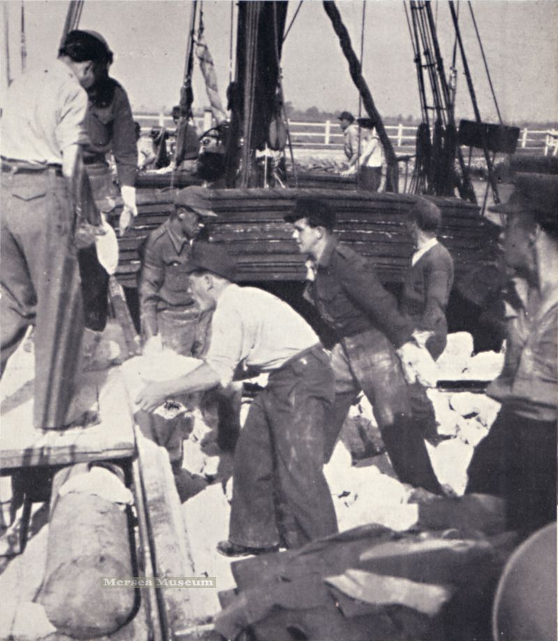  Barge P.A.M. discharging stone at Mersea Strood, with a cheerful gang of Ukrainians. From Tide Time by A.S. Bennett, published 1949. Chapter X describes the P.A.M. loading stone at Allington on the Medway and the trip to Mersea Strood. 
Cat1 Mersea-->Strood Cat2 Barges-->Pictures